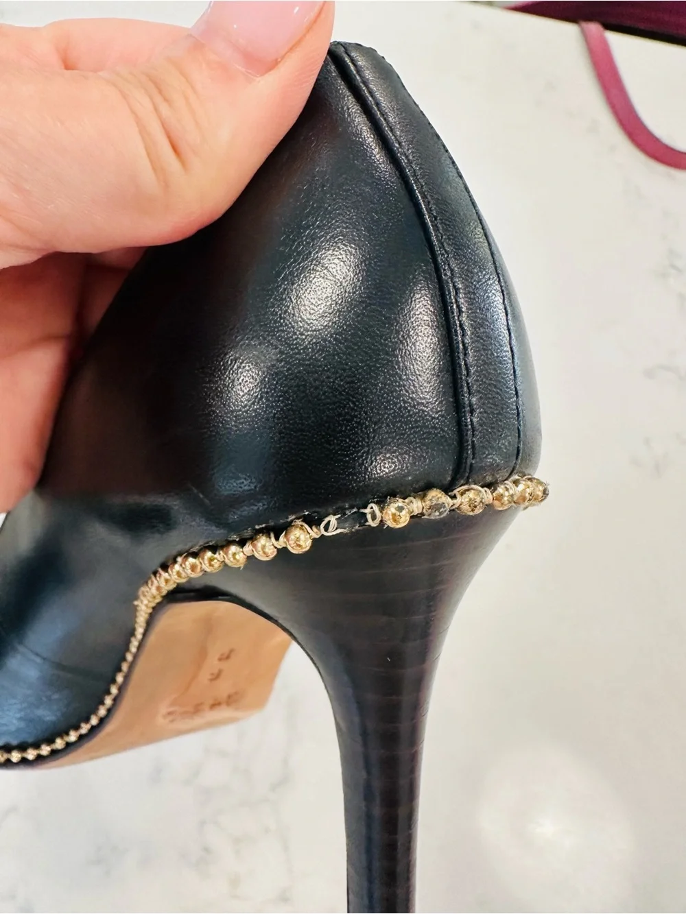 Coach Tamera Black Leather Pointed Toe Pumps with Gold Beaded Accent